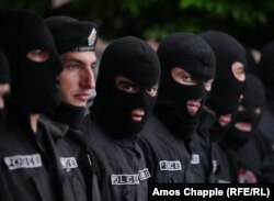 Police stand by as night falls on Yerevan's Republic Square on April 19.