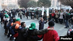 Armenia - Environmental activists demonstrate outside a government building in Yerevan against mining in Syunik, 29Dec2011.