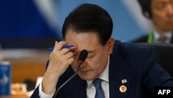 Түштүк Кореянын кызматтан убактылуу четтетилген президенти Юн Сок Ёл.