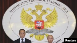 Russia -- President Vladimir Putin (R) and Foreign Minister Sergei Lavrov attend a meeting with Russian ambassadors at the Foreign Ministry headquarters in Moscow, 09Jul2012