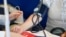 Moldova: Heart Day. Checking blood pressure in a woman