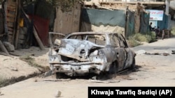 Кабулдагы райондордун биринен ракета атылган автоунаа.  30-август, 2021-жыл. 