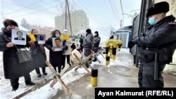 Protesters outside the consulate in Almaty say their relatives have been illegally held in China. 
