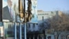 Сожженный баннер с портретом Назарбаева в городе Жанаозен. 19 декабря 2011 года.