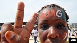 Ivory Coast --  A female supporter waits for the arrival of the leader of the Ivorian "Patriots" and national youth campaign director for presidential candidate and incumbent Ivory Coast President in Abidjan, 06Mar2010