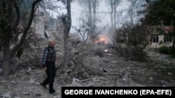 A man walks in front of a damaged school after a Russian missile strike hit the city of Kramatorsk on July 21.