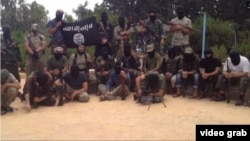 Скриншот видеоролика ИГ, на котором, предположительно, боевики - выходцы из Центральной Азии.   