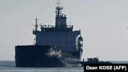 A cargo ship loaded with grain undergoes an inspection in the anchorage area of the southern entrance to the Bosphorus in Istanbul on October 31.