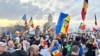 People gather in front of the Constitutional Court in Bucharest as it hears the appeal of far-right politician Calin Georgescu over the rejection of his candidacy in a May presidential election.