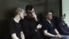 Left to right: Vyacheslav Kryukov, Ruslan Kostylenkov, Pyotr Karamzin and Dmitry Poletayev, members of the New Greatness youth activist group, attend a court hearing in Moscow on July 14. 