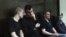 Left to right: Vyacheslav Kryukov, Ruslan Kostylenkov, Pyotr Karamzin and Dmitry Poletayev, members of the New Greatness youth activist group, attend a court hearing in Moscow on July 14. 