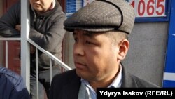 Эрлан Абдымомунов.