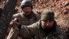 Ukrainian soldiers are seen inside a trench outside the frontline town of Bakhmut on March 4.