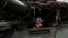A Ukrainian soldier sits in a tank at the front line near Bakhmut on March 6.