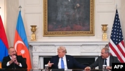 U.S. President Donald Trump, Azerbaijani President Ilham Aliyev and Armenian Prime Minister Nikol Pashinian react after signing an agreement in the White House, Washington, August 8, 2025.