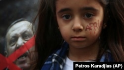 Кипрдеги нааразылык акциясына катышкан күрт кызы, 24-январь 2018-жыл.