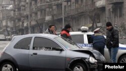 Armenia -- Traffic police investigate a car collision in Yerevan, 11Jan2010.