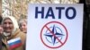 Учасники мітингу проти НАТО