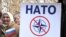 Учасники мітингу проти НАТО