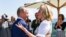 Then-Austrian Foreign Minister Karin Kneissl dances with Russian President Vladimir Putin at her wedding on August 18, 2018.