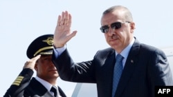 Таіп Эрдаган, архіўнае фота