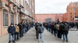 RUSSIA -- Migrant workers wearing protective face masks queue outside a migration control centre to prolong their stay in Russia amid the ongoing coronavirus COVID-19 pandemic in St. Petersburg, April 3, 2020