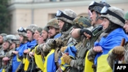 Бійці з батальйону спецпризначення МВС України «Східний корпус» під час церемонії відправки на Донбас в зону збройного протистояння з російськими гібридними силами. Харків, 30 червня 2015 року