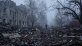 A Ukrainian soldier walks next to destroyed buildings in the frontline town of Kostyantynivka on November 28.
