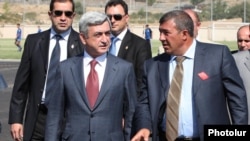 Armenia - President Serzh Sarkisian and businessman Ruben Hayrapetian (R) visit a football academy in Yerevan, 1Sep2010.