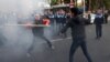 A clash between opposition activist Shant Harutiunian (left) and an unknown man in Yerevan during a march on November 5. 