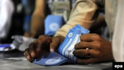 A worker of the Afghan Independent Election Commission recounts ballot in Kabul last month.
