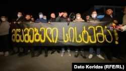 The apparent beating of a deaf-mute boy has caused outrage in Georgia, sparking protests against police violence such as this one in Tbilisi on January 24. 