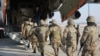 Armenian servicemen board a plane heading for a peacekeeping mission as part of the CSTO in Kazakhstan in January 2022.