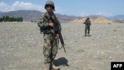 Soldiers from the Afghan National Army (ANA) patrol the vicinity of Jalalabad.