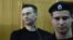 Russian opposition leader Aleksei Navalny attends a court hearing after being detained at a protest rally against corruption in Moscow on March 27.