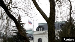 The national flag of Russia flies above the Russian Embassy in Prague. (file photo)