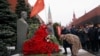 A woman bows her head to the bust of Soviet leader Josef Stalin during a ceremony marking the 66th anniversary of his death in Red Square, Moscow, on March 5. 