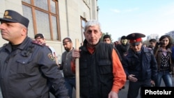 Armeniam opposition activist Shant Harutiunian (center) leads an antigovernment demonstration from Yerevan's Liberty Square late last year. 