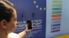 Armenia - A mobile phone is charged by a solar-powered bus stop in Yerevan donated by the EU, 7Jul2017. 