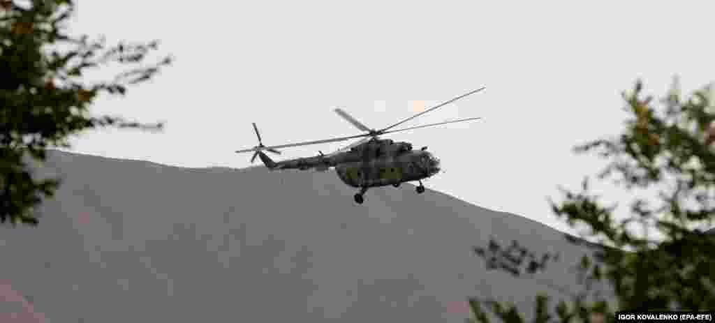 A helicopter above the compound.&nbsp;