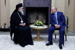 Іоанн X, православний патріарх Антіохійський, і президент Росії Володимир Путін. Москва, 4 грудня 2017 року