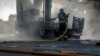 A firefighter at a gas station in Sumy, Ukraine, following a Russian attack on August 15 