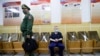 A Russian recruit waits for a medical check-up during spring conscription at a recruitment center in St. Petersburg.