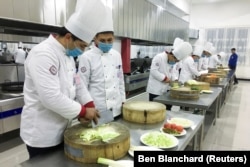 Урок кулинарного мастерства в «центре» в Каракасе во время организованного властями визита журналистов, 3 января 2019 года.