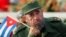 Cuba -- Cuban President Fidel Castro listens to a speaker during the May Day parade in Havana's Revolution Square, May 1, 2005
