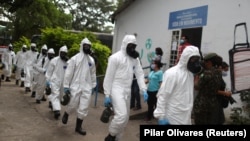 Рио-де-Жанейро шаарындагы санитардык кызматкерлер, 14-май 2020-жыл. 