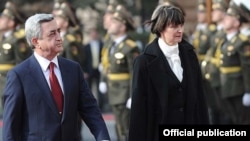 Armenia -- President Serzh Sarkisian and his visiting Swiss counterpart, Micheline Calmy-Rey, inspect the Armenian honor guard outside the presidential palace in Yerevan, 31Mar2011.