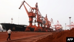 Soil containing various rare-earth elements waits to be loaded on to a ship at a port in Lianyungang, China. (File photo)