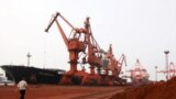 Soil containing various rare-earth elements waits to be loaded on to a ship at a port in Lianyungang, China. (File photo)