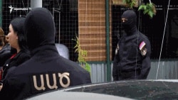 Armenia -- National Security Service officers are seen outside the home of Ucom CEO Ara Khachatrian, Yerevan, May 2, 2020.